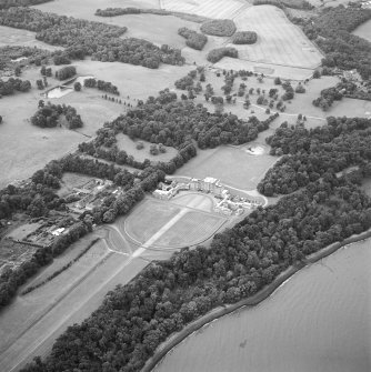 Oblique aerial view centred on the house, taken from the NE.