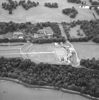 Oblique aerial view centred on the house, taken from the NNE.