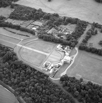 Oblique aerial view centred on the house, taken from the NW.