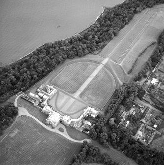 Oblique aerial view centred on the house, taken from the SW.