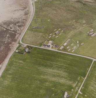 Hoy, Doonatown, oblique aerial view, taken from the NE, centred on The Garrison Theatre, Lyness Military Headquarters and Camp, and a ruined farmstead.