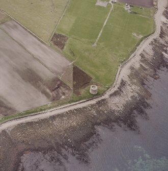 Hoy, Crockness, oblique aerial view, taken from the ESE, centred on the Martello Tower. A curving linear soilmark is visible in the centre left of the photograph.