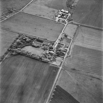 Hoy, oblique aerial view, taken from the NE, centred on Melsetter House, and showing the remains of a military camp in the top left-hand corner of the photograph.