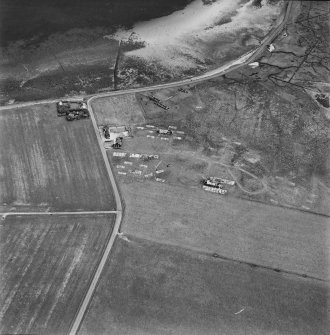 Hoy, Doonatown, oblique aerial view, taken from the NNW, centred on The Garrison Theatre, Lyness Military Headquarters and Camp, and a ruined farmstead.