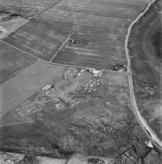 Hoy, Doonatown, oblique aerial view, taken from the SW, centred on The Garrison Theatre, Lyness Military Headquarters and Camp, and a ruined farmstead.