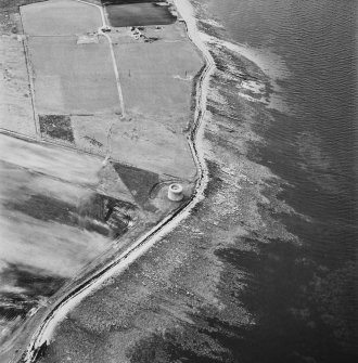 Hoy, Crockness, oblique aerial view, taken from the SE, centred on the Martello Tower. A curving linear soilmark is visible in the bottom left hand corner of the photograph.