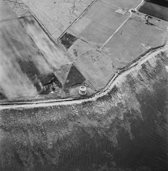 Hoy, Crockness, oblique aerial view, taken from the E, centred on the Martello Tower. A curving linear soilmark is visible in the top left hand corner of the photograph.