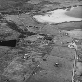 Hoy, Lyness, oblique aerial view, taken from the S, centred on the Naval Cemetery and a pumping station, and showing the edge of the Royal Naval Oil Terminal in the right half of the photograph.