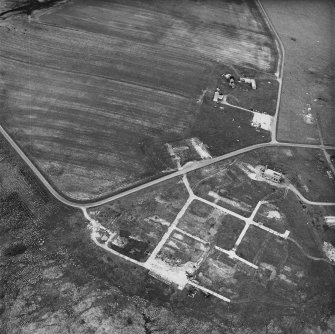 Hoy, Ore Farm, oblique aerial view, taken from the WSW, centred on the ammunition storage huts.