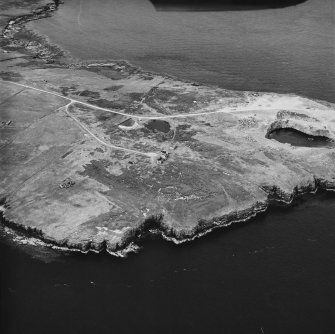 Flotta, Stanger Head, oblique aerial view, taken from the WSW, centred on the Naval Signal Station, and showing the Coast Battery in the centre right of the photograph