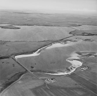 Oblique aerial view from SW, centred on Barrier No. 3 and showing the island of Glimp's Holm in the centre left of the photograph. Barriers No's. 1 and 2 are visible in the top right-hand corner area.