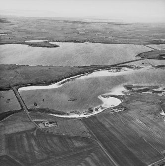 Oblique aerial view from S, centred on the island of Glimp's Holm, and showing barrier No.3 in the centre left of the photograph. Barriers No's. 1 and 2 are visible in the top right-hand corner area.