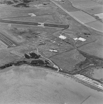 Oblique aerial view from N.  Visible are two Mainhill type hangars, a hangar base and two protected dispersal bays.