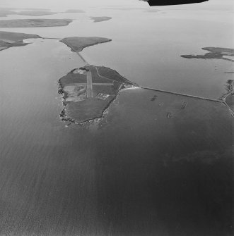 Aerial view, Orkney, Lamb Holm taken from the NE.  Also visible are Churchill Barriers Nos.1, 2 and 3, in the background the Island of Glimps Holm and the west coast of South Ronaldsay.