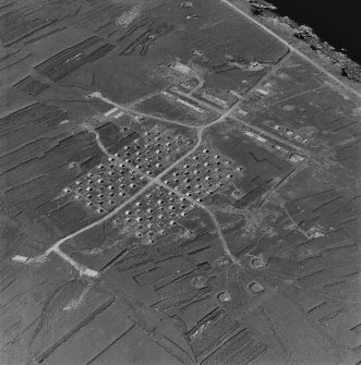 Oblique aerial view of Orkney, Flotta, 'Z' anti-aircraft battery and accommodation camp, taken from the SE. Also visible is a dummy anti-aircraft battery.