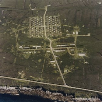 Oblique aerial view of Flotta, Golta, 'Z' battery and accommodation camp, taken from the N.  Also visible is a barrage balloon mooring site.