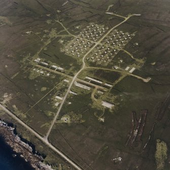 Oblique aerial view of Flotta, Golta, 'Z' battery and accommodation camp, taken from the N.  Also visible is a barrage balloon mooring site.