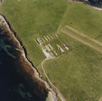 Oblique aerial view of Orkney, Lamb Holm, Italian Chapel and the remains of the prisoner-of-war camp, taken from the W.