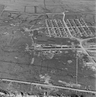 Oblique aerial view of Orkney, Flotta, Golta, of a 'Z' battery of unrotating fixed projectile launchers with ammunition huts, the hut bases of the accommodation camp, cable trenches and several other structures.  In addition, a small barrage balloon mooring site is also visible.  Taken from NNE.