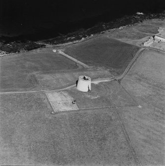 Oblique aerial view centred on Martello tower from SSW.