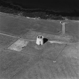 Oblique aerial view centred on Martello tower from S.