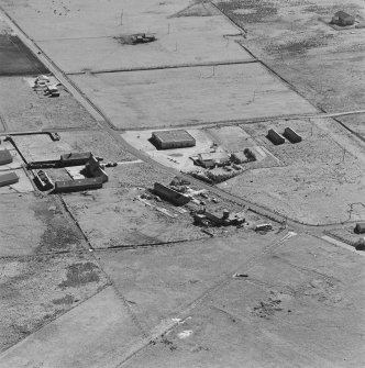 Oblique aerial view of Orkney, Hoy, Lyness, Royal Naval Oil Terminal, view from NE, of the Haybrake Camp area with the site of the C.P.O.'s and P.O.'s and ratings camp to the W of the road.
