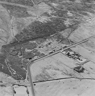 Oblique aerial view of Orkney, Hoy, Lyness, Royal Naval Oil Terminal, view from SE, of concrete hut bases of the officers' quarters to the NW of the Naval Base.