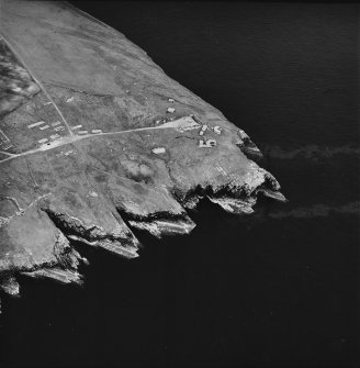 Oblique aerial view, taken from the NW, centred on Hoxa Batteries and Camp Site.