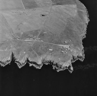 Oblique aerial view of Orkney, South Ronaldsay, Hoxa Head, taken from the W.  Visible is Second World War Hoxa Battery and part of the two open gun-emplacements First World War Hoxa Battery.