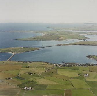 Oblique aerial view from N.  Visible are the Islands of Lamb Holm, Glimps Holm and Burray. The village of St Mary's is also visible.
