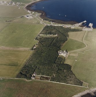 Oblique aerial view of Orkney, Shapinsay, Balfour Castle and walled garden, Balfour village and harbour, taken from the W.