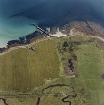 Oblique aerial view of Orkney, Swanbister House, First World War seaplane base, taken from the W.  Visible is the Royal Navy pier and former landing strip.