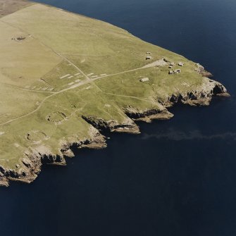 Oblique aerial view of Orkney, South Ronaldsay, Hoxa Head, First and Second World War coastal batteries taken from the NW.  Also visible are the concrete hut bases of the accommodation camp.