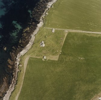 Oblique aerial view of Orkney, Burray, Second World War Northfield coastal battery and the Broch of Burray taken from the WSW.