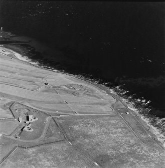 Oblique aerial view of Orkney, taken from the W of Ness WW II coast battery and accommodation camp with Ness WWI coast battery and Links WWII coast battery in the background.