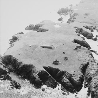 Oblique aerial view centred on the remains of the radar station, taken from the ENE.