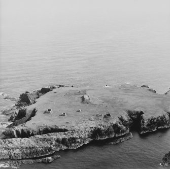 Oblique aerial view centred on the remains of the radar station, taken from the N.