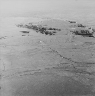 Oblique aerial view centred on the remains of the radar station, taken from the WNW.