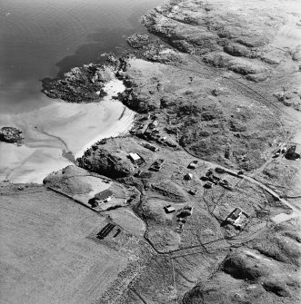 Oblique aerial view of Sorisdale centred on cottages, taken from the N.