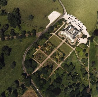 Oblique aerial view centred on the country house and garden, taken from the S.