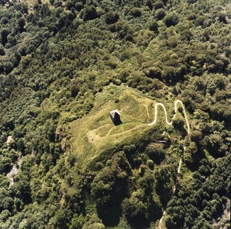 Oblique aerial view centred on the tower and remains of the fort, taken from the NE.