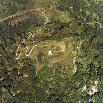 Oblique aerial view centred on the tower and remains of the fort, taken from the SW.