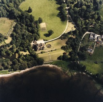 Oblique aerial view centred on Ardkinglas House with the steading and remains of the old house adjacent, taken from the NW.