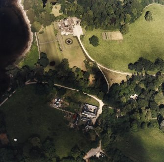 Oblique aerial view centred on Ardkinglas House with the steading and remains of the old house adjacent, taken from the SW.
