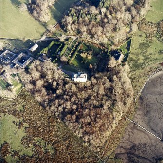 Oblique aerial view centred on the castle and the farmstead, taken from the WSW.