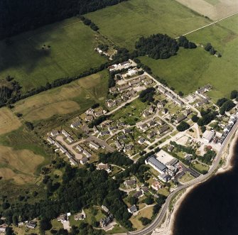 Oblique aerial view centred on the village, taken from the SSE.
