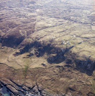 Oblique aerial view centred on the radar station and the remains of the dun, taken from the WNW.