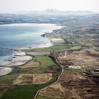 General oblique aerial view looking across Ardlarach towards Bowmore and the Paps of Jura beyond, taken from the WSW.