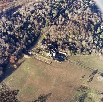 Oblique aerial view centred on the remains of the country house and gardens, taken from the SSE.