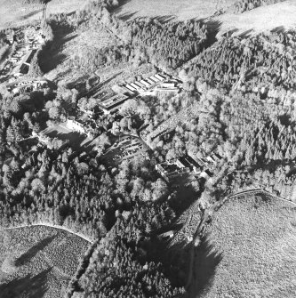 Oblique aerial view centred on the farmstead, the country house and hotel, taken from the SSE.